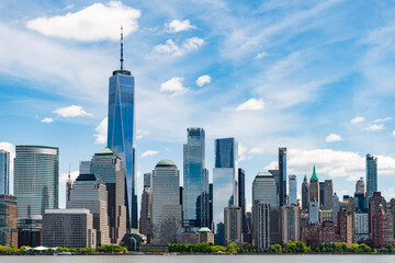 Obraz premium A view of the New York financial district fom Paulus Hook Pier in Jersey City, New Jersey.New York, United States. Manhattan New York NY NYC Skyline. Lower Manhattan and One World Trade Center in New