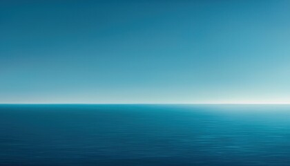 Obraz premium A serene view of a calm ocean meeting a clear blue sky, conveying tranquility and vastness.