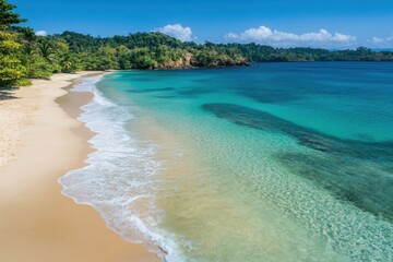 A tranquil tropical beach with clear blue waves, detailed aerial view highlighting the contrast of sand and sea
