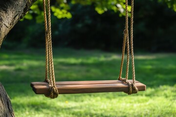 Close-up of a wooden swing seat, ropes tied tightly to a tree branch, soft grass in the background