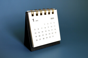 Monthly calendar template for the new year 2025 desk calendar,isolated on blue background.