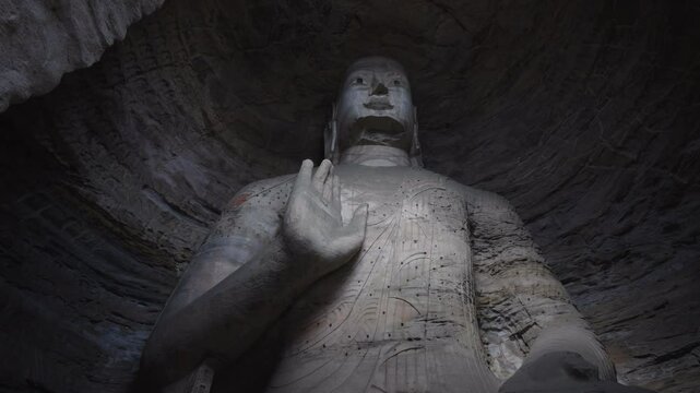 The Yungang Grottoes in Datong, Shanxi Province, China, were originally built 1500 years ago during the Northern Wei Dynasty, featuring,Ancient Buddha sculptures