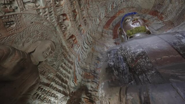 The Yungang Grottoes in Datong, Shanxi Province, China, were originally built 1500 years ago during the Northern Wei Dynasty, featuring,Ancient Buddha sculptures
