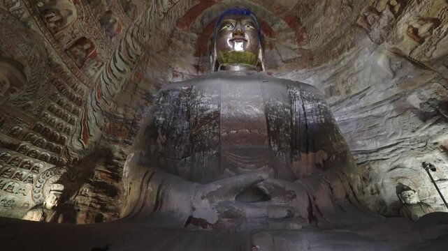 The Yungang Grottoes in Datong, Shanxi Province, China, were originally built 1500 years ago during the Northern Wei Dynasty, featuring,Ancient Buddha sculptures