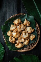 Fototapeta premium A variety of fried seafood snacks served in a bamboo fruit basket.