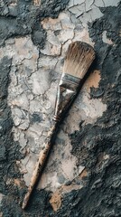 Vintage Paint Brush on Distressed Textured Surface with Peeling Paint