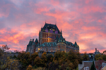 Quebec City Old Town street view in autumn sunset time, stunning red pink clouds over the sky in...