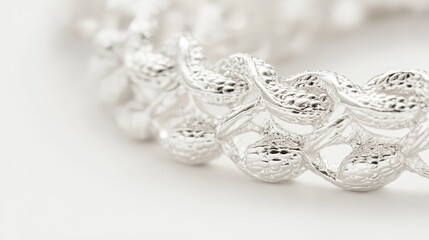 Silver designer costume jewelery in macro on white background