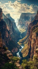 Majestic Canyon Landscape with River and Dramatic Sky at Sunset