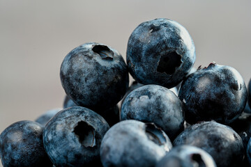 Close-up of blueberries on dark background.Fresh Blueberry Bounty. Close-up of ripe juicy blueberries filling the frame