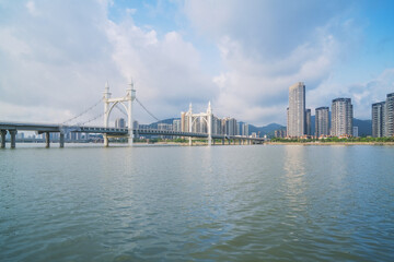 Fototapeta premium Modern urban architecture, bridges, and coastal scenery in Zhuhai, Guangdong Province, China on April 9, 2023
