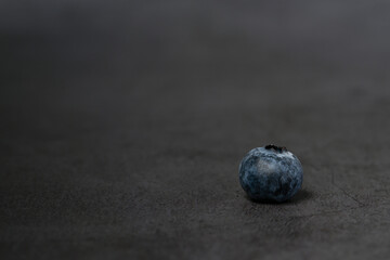 Close-up of blueberries on dark background.Fresh Blueberry Bounty. Close-up of ripe juicy blueberries filling the frame