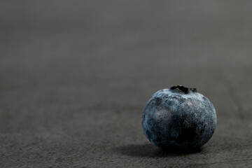 Close-up of blueberries on dark background.Fresh Blueberry Bounty. Close-up of ripe juicy blueberries filling the frame