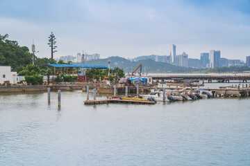 Naklejka premium Modern urban architecture, bridges, and coastal scenery in Zhuhai, Guangdong Province, China on April 9, 2023