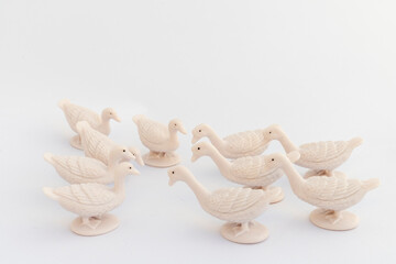 Cluster of white miniature geese on white isolated background