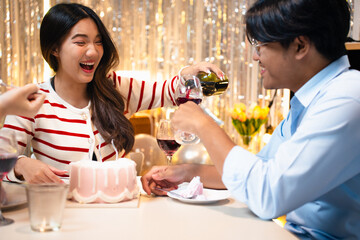 A birthday celebration with friends. A cake with candles is being served. Festive atmosphere with decorations, snacks, and happy people enjoying the party. Friends eating cake at birthday party.