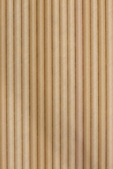 Brown paper straws lined up in a row background backdrop. Sustainable biodegradable recyclable cafe restaurant supplies concept