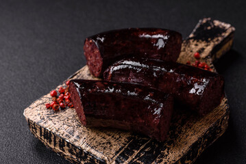 Delicious black blood sausage or black pudding with spices and herbs