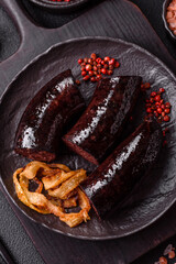 Delicious black blood sausage or black pudding with spices and herbs