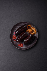 Delicious black blood sausage or black pudding with spices and herbs