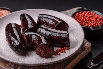 Delicious black blood sausage or black pudding with spices and herbs