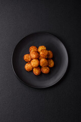 Delicious fried potato balls or croquettes with salt, spices and herbs