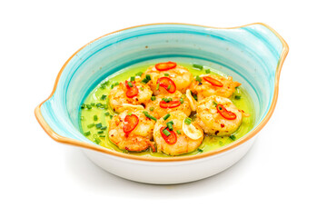 Appetizer with shrimps, onions and tomatoes on a white porcelain plate