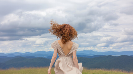 Obraz premium Girl in harmony with nature under a dramatic sky