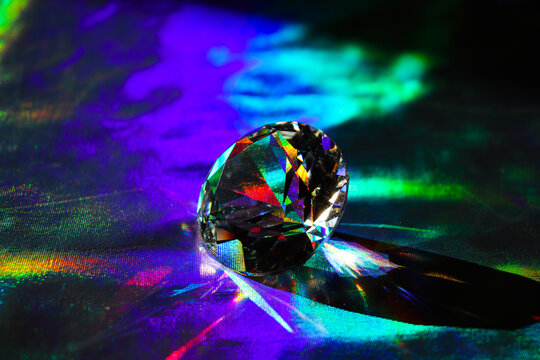 Holographic fabric texture. A diamond lies on a shiny fabric. Rainbow effect. Prism. - Powered by Adobe