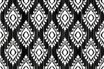 Floral pattern. Vintage wallpaper in the Baroque style. Seamless vector background. White and black ornament for fabric, wallpaper, packaging. Ornate Damask flower.