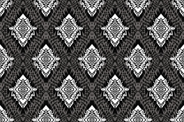 Fototapeta premium ikat pattern, Ethnic ikat seamless pattern, African style, Abstract vector, Chevron embroidery, Paisley embroidery, Navajo aboriginal pattern, Aztec and tribal motifs, Vector hand drawn style.