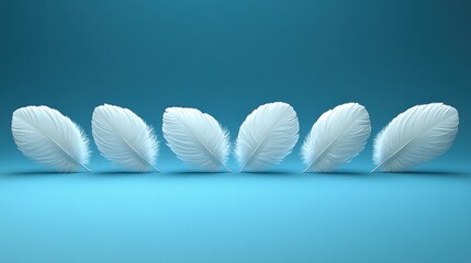 Naklejka premium Five white feathers in a row on blue background.