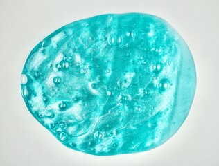 Blue stretchy slime toy object with bubbles texture isolated on horizontal white background.