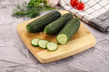 Raw green cucumbers with slices