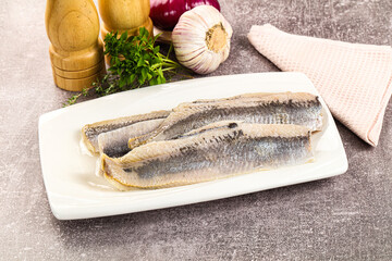Marinated salted herring fillet apetizer