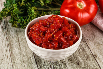 Diced ripe tomato with sauce