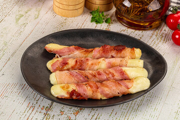Hot mozzarella sticks with bacon