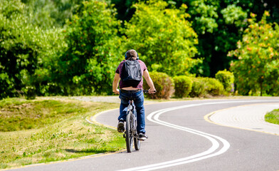 Cyclist ride on the bike path in the city Park
