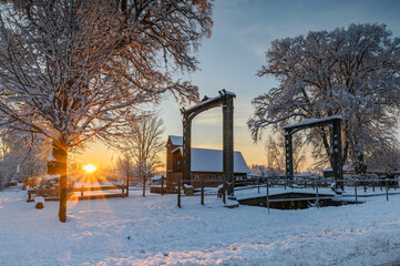 Winter scene of iron portals of historic drawbridge from 1849 at Kluvensiek, situated on Old Eider...