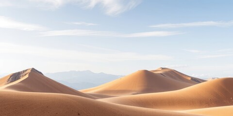 Serene Desert Landscape Under a Pale Sky with Gentle Undulations of Sand Dunes