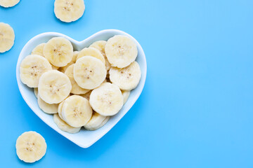 Banana slices on blue background.
