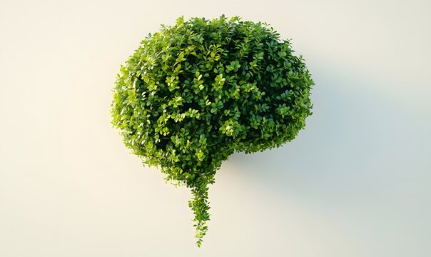 Green plant shaped like a brain with a speech bubble.