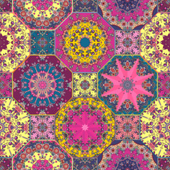 Obraz premium Seamless patchwork pattern with bright mandalas on octagons. The images are created without the use of any artificial intelligence software at any stage.