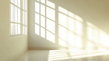 Fototapeta premium Bright and Airy Room with Sunlight Streaming through Large Windows, Creating Beautiful Shadow Patterns on a Soft Cream Wall and Floor