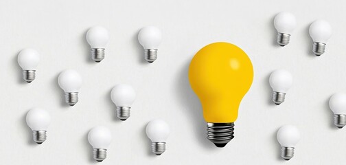 A unique yellow light bulb stands out among white bulbs on a clean background, symbolizing creativity and innovation.