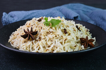Jeera rice also known as cumin rice served in a plate.
