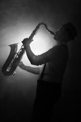 saxophone player on black