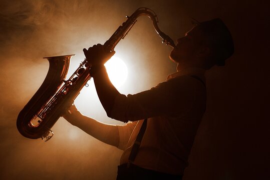 saxophone player in a spotlight