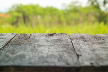 Fototapeta premium Empty top of wooden table and view of sunset or sunrise background