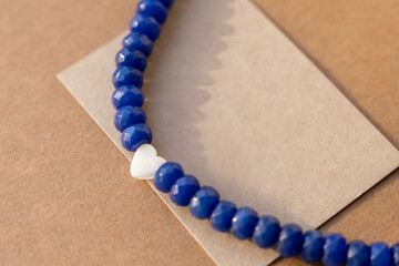 Gemstone necklace made of mother of pearls in shape of hearts.